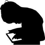 Child in silhouette sitting upright while using a tablet